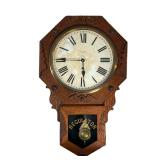 NEW HAVEN CARVED REGULATOR CLOCK | Carved oak wall clock with ornate brass wright made by New Haven 