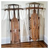 (2PC) PAIR VINTAGE FLEXIBLE FLYER SLEDS | Wooden & metal “Flexible Flyer” sled with iron skis and pa