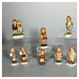 (8PC) HUMMEL LOT #2 | Hummels include: (1) School Girl 81 2/0 4.5”; (1) We Congratulate 220 4”; (1) 