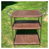 MIDCENTURY BAR CART | Nice 60’s Bar Cart on wheels. Stainless Steel frame with brown metal shelves. 