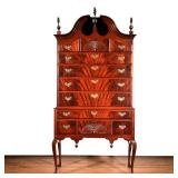 CHIPPENDALE FLAME MAHOGANY BONNET TOP HIGHBOY | With turned carved finials, open bonnet top, two car