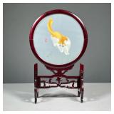 CHINESE SILKWORK CAT & GRASSHOPPER TABLE SCREEN | In a round wood frame with carved fretwork support