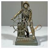 SHIP CAPTAIN LAMP | Brass table lamp in the form of a fisherman at the wheel. - l. 4.25 x w. 3.5 x h
