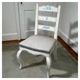 WHITE PAINTED LADDERBACK CHAIR | Cushioned chair painted with floral detail. - l. 20.5 x w. 18 x h. 