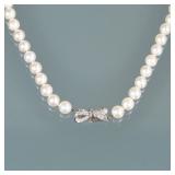 PEARL NECKLACE WITH DIAMOND CLASP | Designed as a strand of white 9 mm pearls terminating in a plati