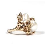 BAROQUE PEARL & DIAMOND RING | Having two white baroque pearls (11.2 mm large) set in an organic oce