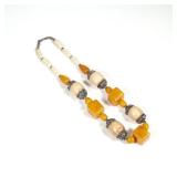 UNUSUAL CARVED BONE & AMBER NECKLACE | Having four oval carved bone links (26mm) with silver mounts 