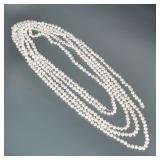 VERY LONG STRAND OF BAROQUE PEARLS | Designed as a very long knotted strand of (approx. 6.5mm) baroq