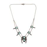 STERLING & SILVER SQUASH BLOSSOM | Native American squash blossom of small size, having six turquois