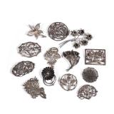 (13pc) STERLING FLOWER PINS | Sterling silver flower-shaped brooches and pins, each marked or tested