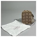 COACH PHONE WRISTLET | Small coach phone case/wallet with allover print. - l. 3.5 x w. 1 x h. 5 in
