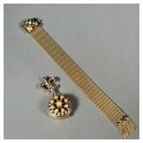 (2PC) GOLD-TONE JEWELRY | Including a fleur de lis locket pendant/pin with four picture frames (h. 2