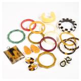 BAKELITE COLLECTION | Bakelite and other jewelry, including 13 bracelets, a pair of orange clips, a 