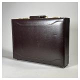 LEATHER PRESTO BRIEFCASE | Dark maroon/brown sturdy leather briefcase with two combination locks at 