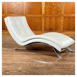 LEATHER MODERN CHAISE LOUNGE | Square patterned leather curved lounger with a mirrored steel frame. 