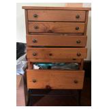 SIX-DRAWER STORAGE CHEST | Raised on a wrought iron stand with splayed legs.