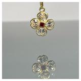 18K GOLD PENDANT | 18k yellow gold flower or clover pendant with four CZs and a red faceted stone in