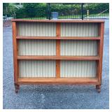 ANTIQUE PINE BOOKCASE | Open sides with X form supports, paneled back. - l. 48 x w. 9 x h. 40 in