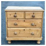 ANTIQUE PINE CHEST OF DRAWER | Having two half drawers over two full drawers, turned pulls and bun f