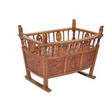 ANTIQUE CARVED OAK BABY CRIB | With intricate carvings, spindle sides. - l. 39.75 x w. 27 x h. 28.5 