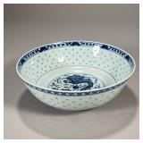 CHINESE DRAGON BOWL | Blue and white glazed porcelain center bowl with "pass-through" decoration, ha