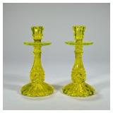 PAIR URANIUM GLASS CANDLESTICKS | Uranium glass candlesticks with flared base. - h. 8.5 x dia. 4 in