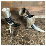 (2pc) Viking Drinking Horns | Two Drinking Horns including: *Horn with brass rim in a horn stand. *H