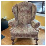 Ethan Allen Wing Chair | Paisley design upholstery in a light brown with red. Claw and ball feet. Da