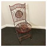 Chinese Wrought Iron Chair | An iron folding chair with Chinese/Asian designs and circular seat. - l