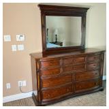 Universal Furniture Dresser & Mirror | 10 Drawer dresser in mahogany with attached mirror. Serpentin