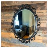 Bronzed Oval Mirror "Quoizel" | Beveled Mirror in a bronze finished iron with scrollwork and leaves 