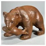 CARVED WOOD BEAR | Hand-carved wood bear figurine with fish in its mouth. - l. 7.5 x w. 3.75 x h. 5 