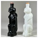 (2pc) PAIR EARLY BEAR FORM GLASS BOTTLES | One black and one white standing bear bottle, each marked