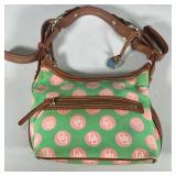 DOONEY & BOURKE CANVAS & LEATHER PURSE | Dooney & Bourke canvas logo purse with leather trim. - l. 1