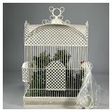 BIRDCAGE PLANTER | Large birdcage filled with artificial plants. - l. 15 x w. 9.5 x h. 24 in