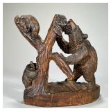 WOOD CARVED MAMA BEAR & CUBS | Carved wood sculpture depicting a mother bear eating berries with her