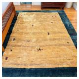 Wool Persian Gabbeh Carpet | Roomsize carpet of high wool pile, having a yellow beige field within a