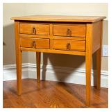 Pine Side Table | With four dovetailed drawers with metal pulls, over square tapering legs. - l. 30 