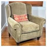 Crate & Barrel Wingback Chair | Olive green chenille upholstery with brass tacks on the arm fronts a