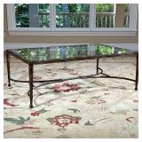 Metal Frame Low Table | Coffee table having a beveled glass top over a bronzed metal frame with shap