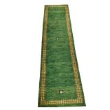 GEOMETRIG GREEN RUNNER | Green wool rug, having 3 small colorful squares with geometric border on a 