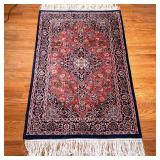 Medallion Area Rug | Central medallion within concentric borders, with long fringe at the ends. - l.