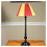 Turned Wood Table Lamp | Black painted wood twisted form table lamp with a painted tole style shade.