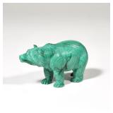 CARVED MALACHITE BEAR | A carved malachite bear with fur details, depicted standing on all fours, wi