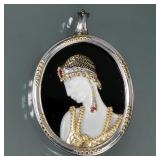 ERTE RUBY, DIAMOND, GOLD & STERLING PIN | Art Deco Salome brooch/pendant designed as a mother of pea