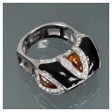 ENAMEL & AMBER 18K GOLD RING | Italian, designed as smoothed teardrop amber alternating with black e