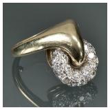 DIAMOND, PLATINUM, & 14K GOLD SPINNER RING | Designed as an articulating platinum donut,-form wheel 