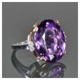 OVAL CUT AMETHYST, DIAMOND & 14K GOLD RING | Designed as a central oval mixed cut amethyst (22 x 17.