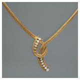 DIAMOND & 18K GOLD ITALIAN NECKLACE | Designed as a double snake chain with a conforming "knot" moun