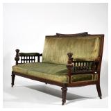 AESTHETIC PERIOD ROSEWOOD SETTEE | Late 19th century, profusedly carved and decorated; the crest rai